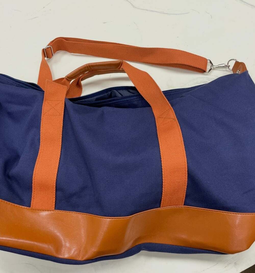 Navy Blue Canvas Duffle Bag with Tan Faux Leather Bottom and Orange Straps